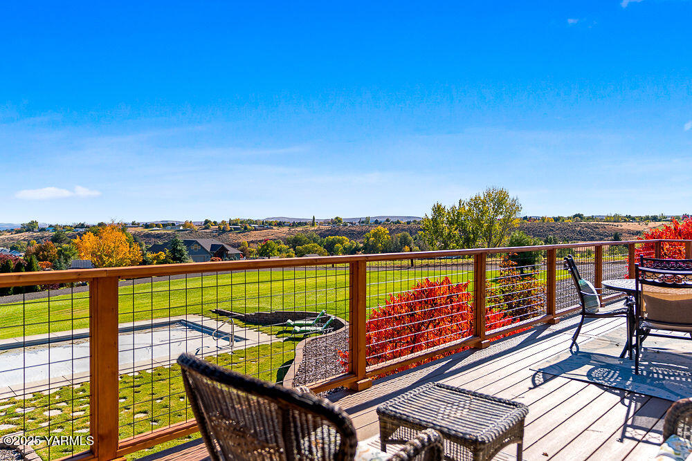 283 Cook Road Yakima, WA 98908 - Photo 61 of 64 a view of a balcony with wooden chairs