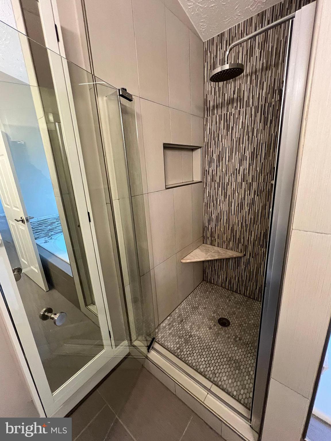 8334 Lyndhurst Street Laurel, MD 20724 - Photo 12 of 16 a bathroom with a shower and toilet