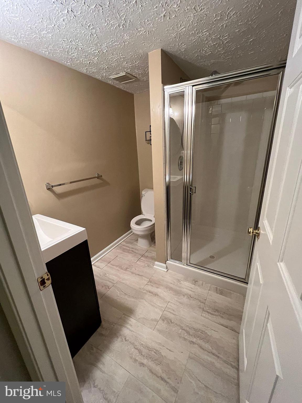 8334 Lyndhurst Street Laurel, MD 20724 - Photo 14 of 16 a bathroom with a shower and a toilet