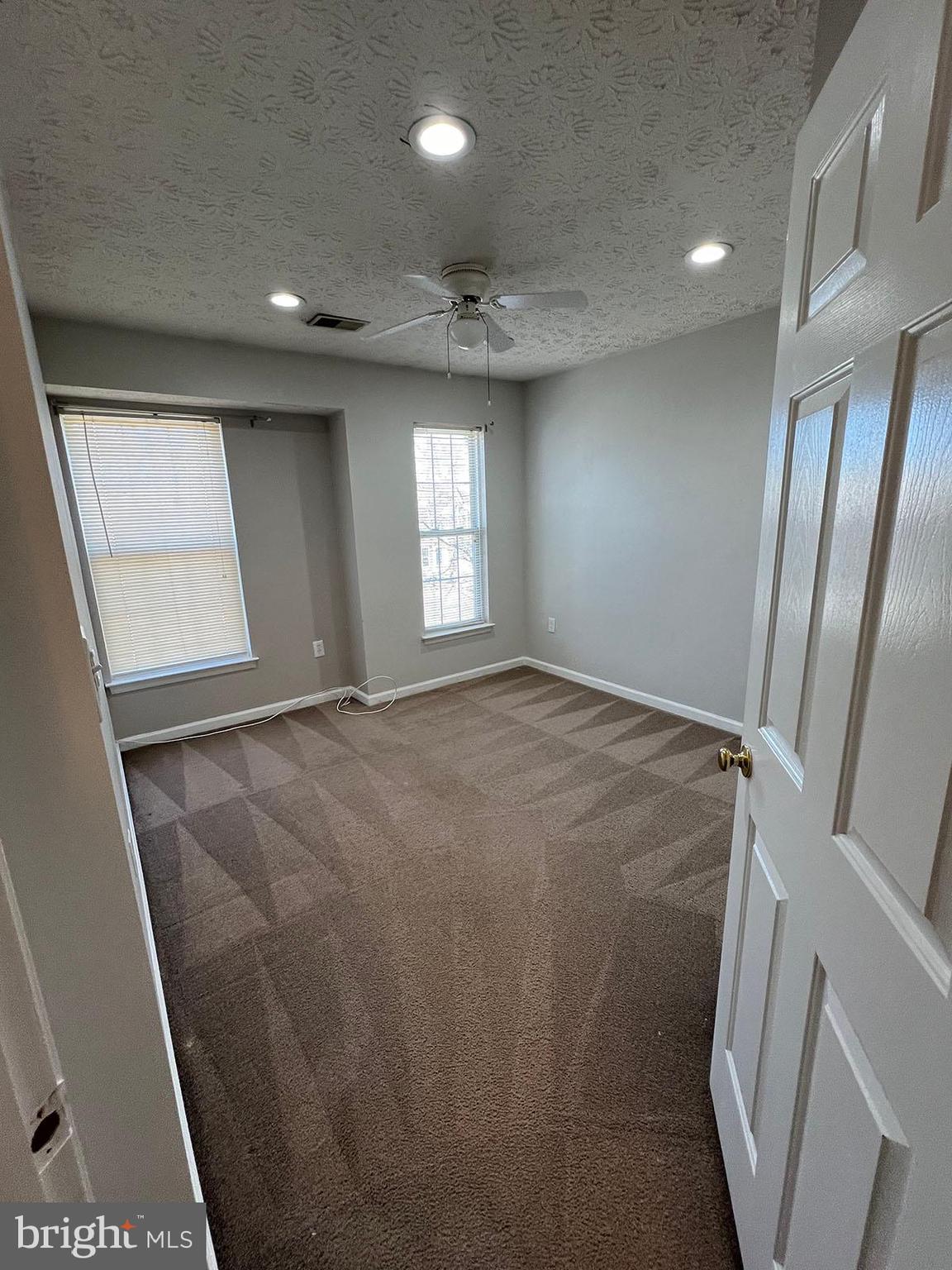 8334 Lyndhurst Street Laurel, MD 20724 - Photo 7 of 16 a view of hallway with window and stairs