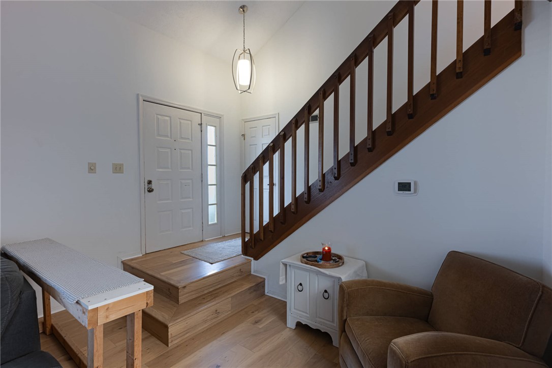 5399 Country Ridge Drive Mason, OH 45040 - Photo 29 of 29 This entry welcomes with an open floor plan and rich hardwood flooring, guiding to a well-crafted staircase.