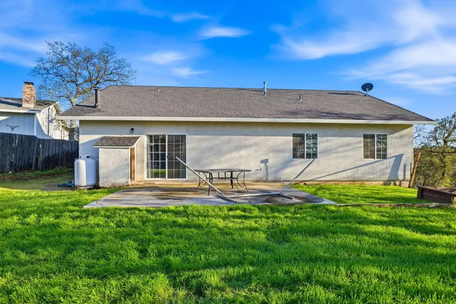 a view of a garden with a building in the background