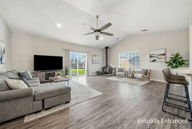 a living room with furniture and a flat screen tv