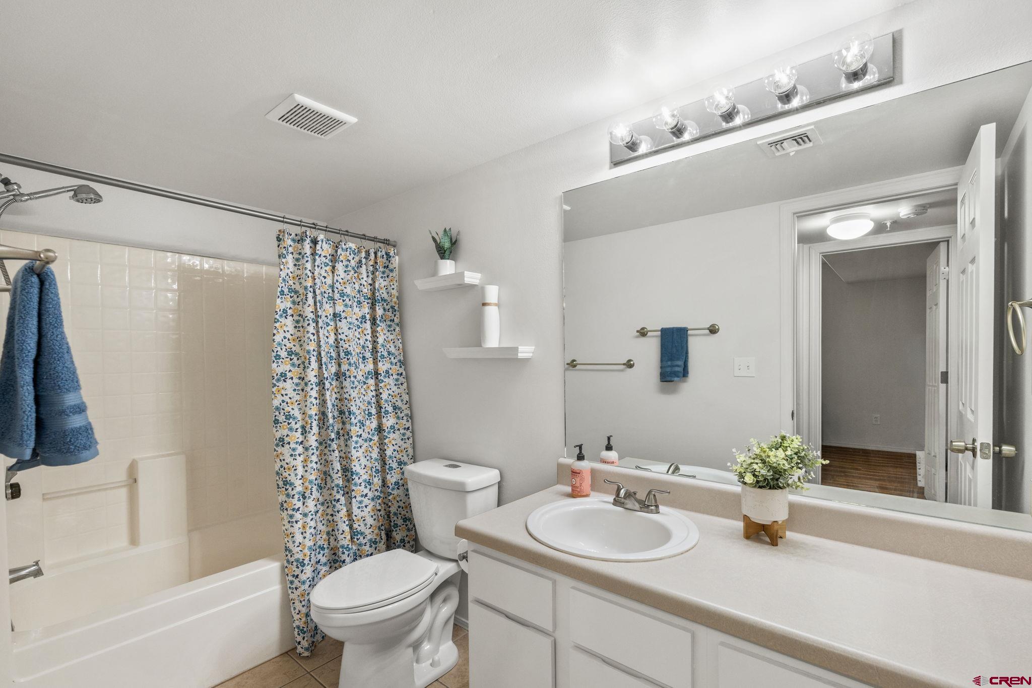 1100 Goeglein Gulch Road, Unit 171 Durango, CO 81301 - Photo 14 of 40 a bathroom with a sink a toilet and shower