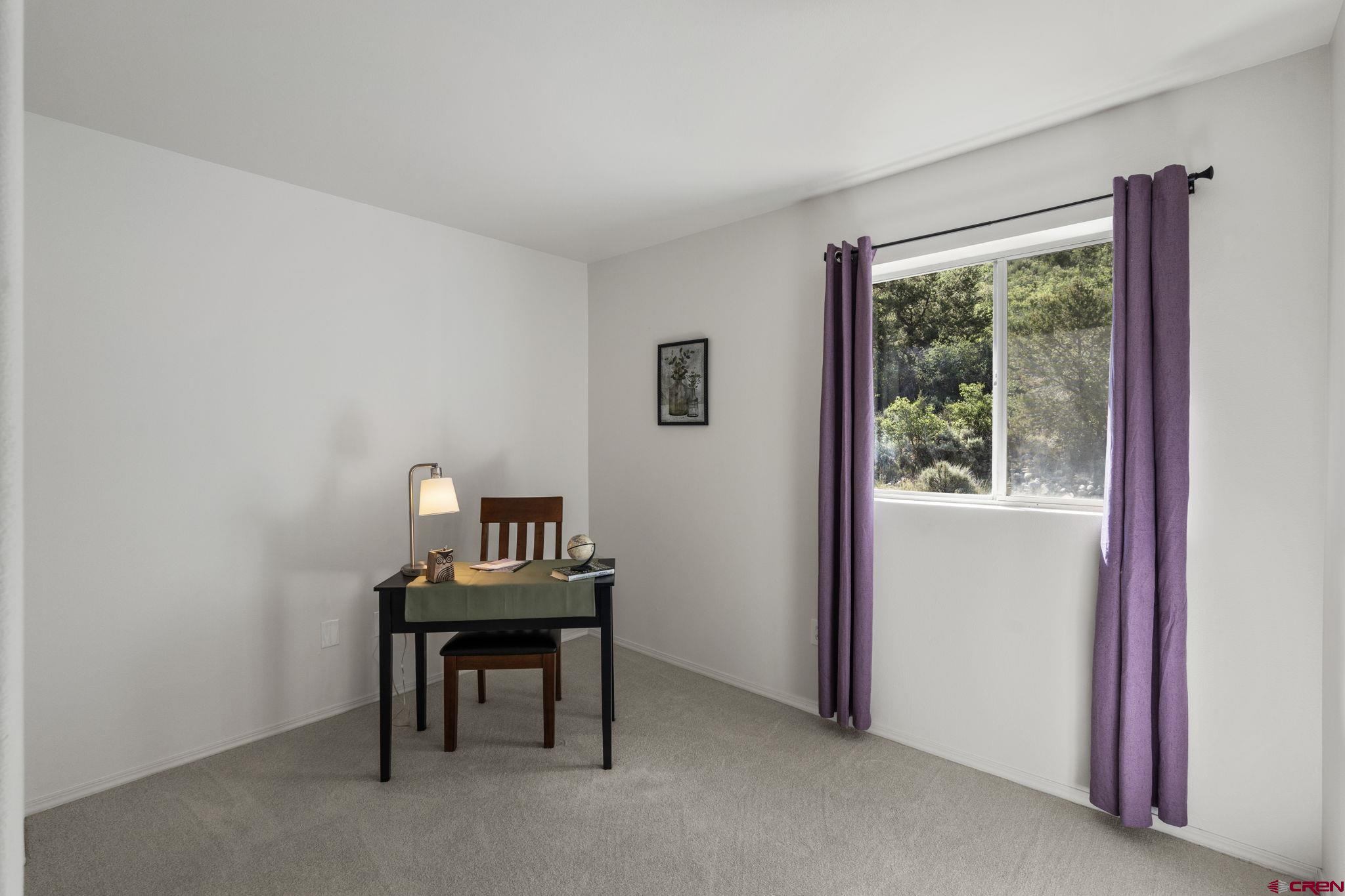 1100 Goeglein Gulch Road, Unit 171 Durango, CO 81301 - Photo 22 of 40 a room with furniture and a window