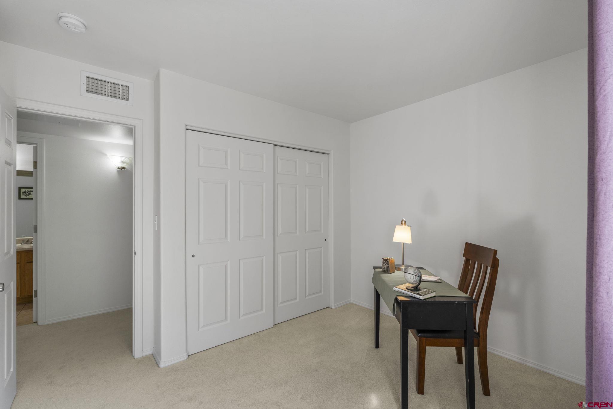 1100 Goeglein Gulch Road, Unit 171 Durango, CO 81301 - Photo 23 of 40 a workspace room with furniture and a potted plant
