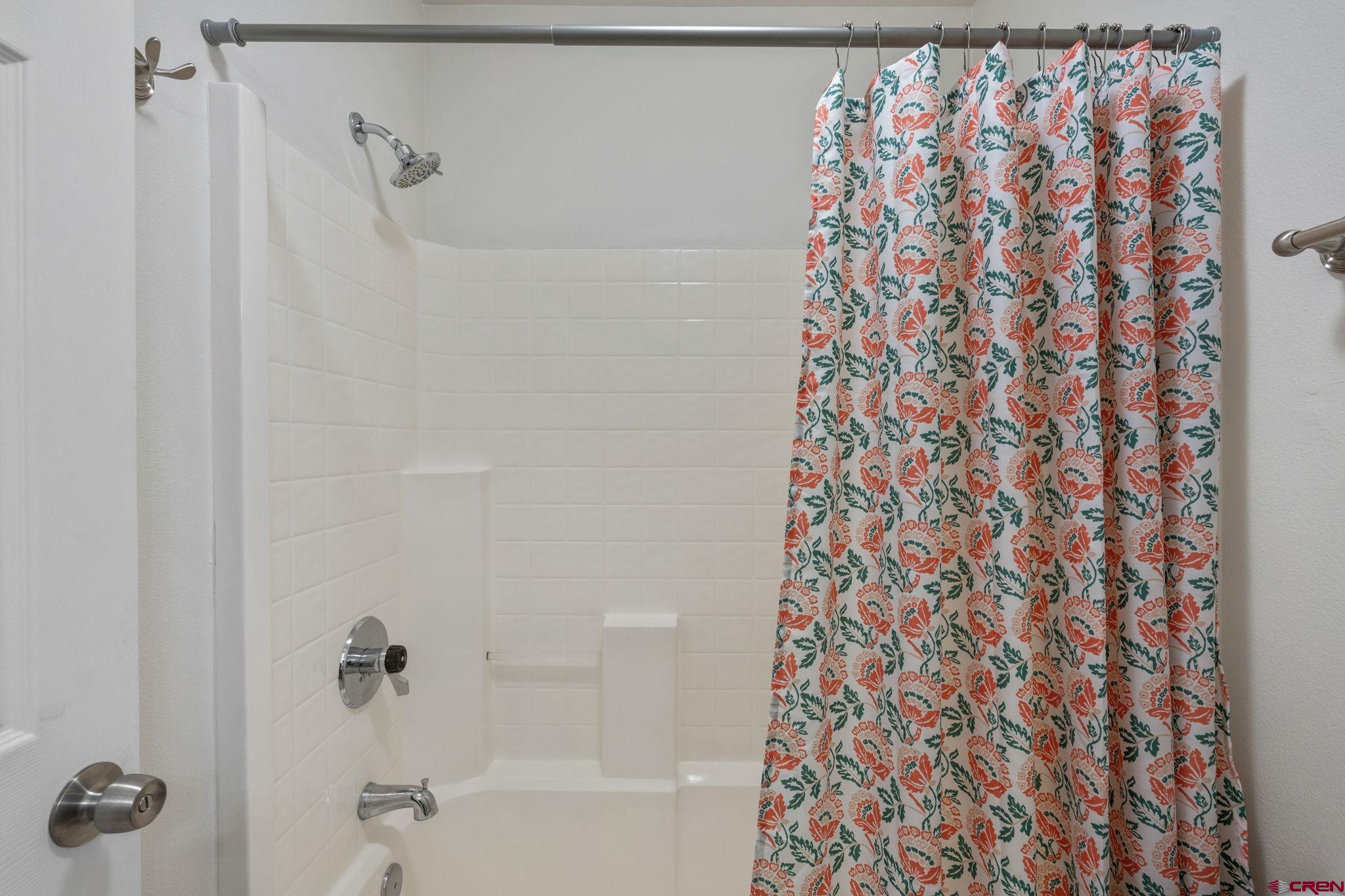 1100 Goeglein Gulch Road, Unit 171 Durango, CO 81301 - Photo 25 of 40 a bathroom with a shower curtain