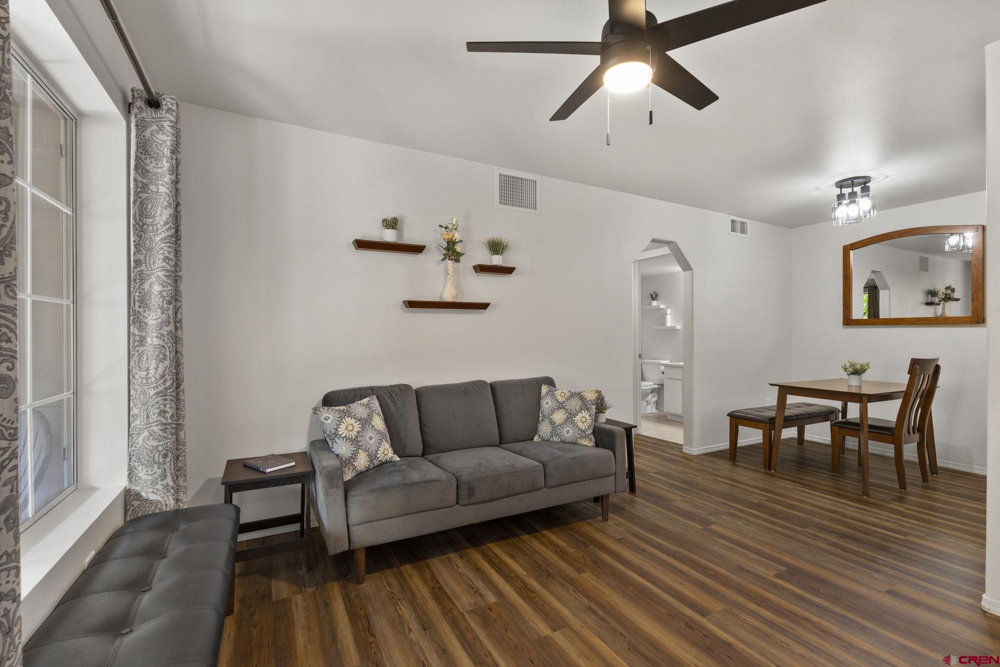 1100 Goeglein Gulch Road, Unit 171 Durango, CO 81301 - Photo 4 of 40 a living room with furniture and a dining table