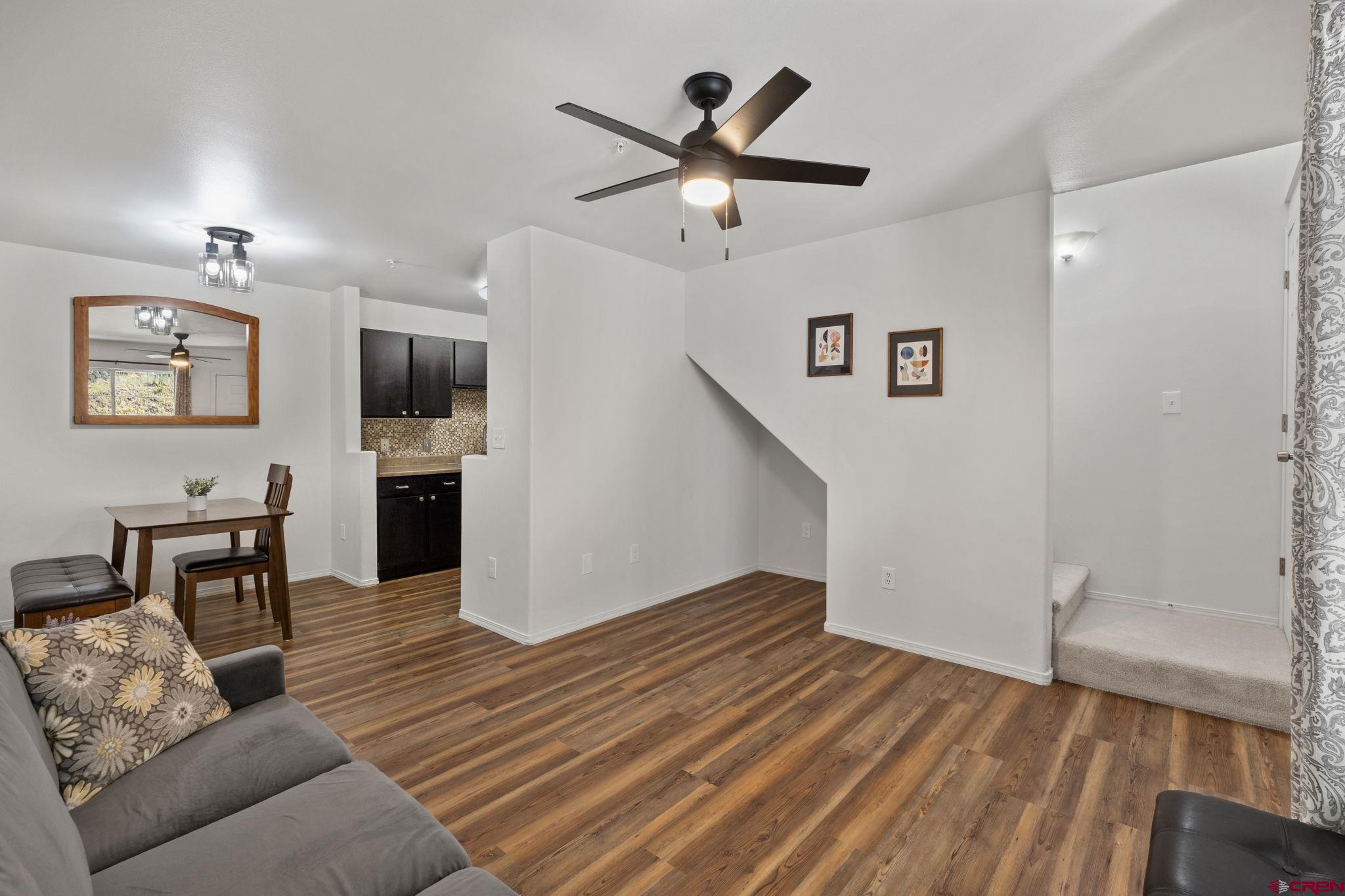 1100 Goeglein Gulch Road, Unit 171 Durango, CO 81301 - Photo 5 of 40 a furnished livingroom with a window and a wooden floor