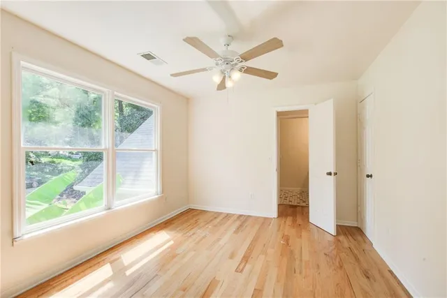 a bathroom with a bathtub and a window