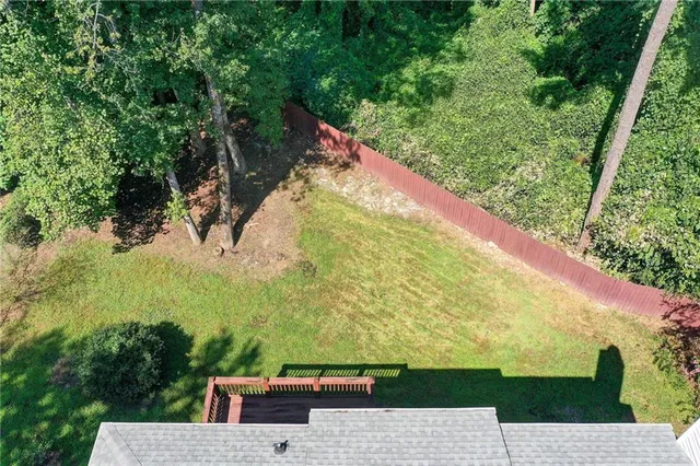 a view of a chairs and table in the garden