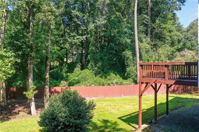 a view of a backyard with pathway