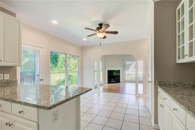 a balcony with wooden floor and fence