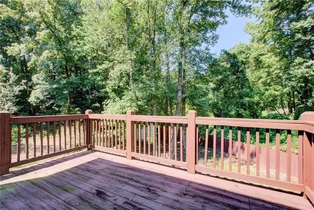 a view of a house with wooden deck