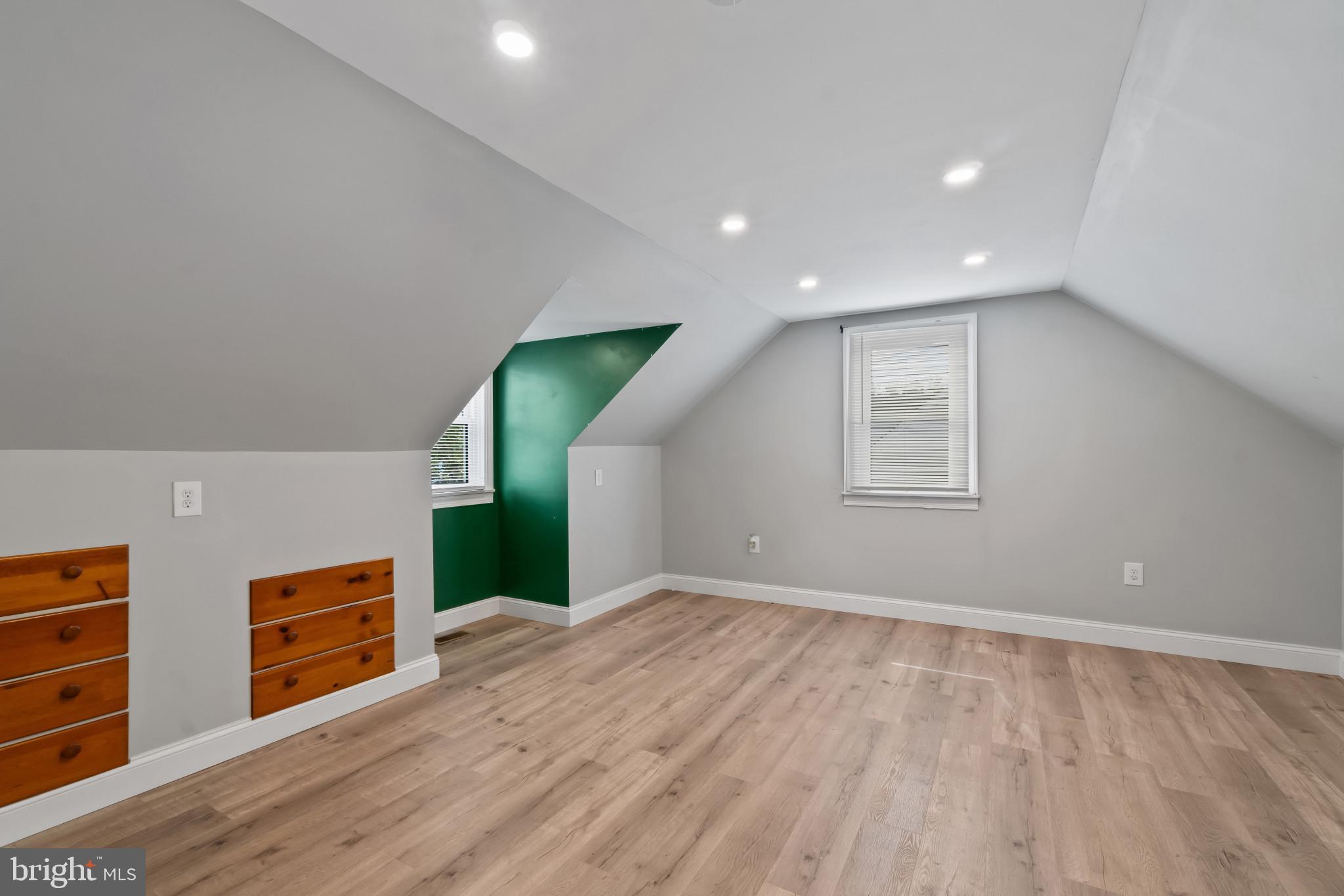 3412 Sollers Point Road Dundalk, MD 21222 - Photo 21 of 31 a view of an empty room with a window and wooden floor