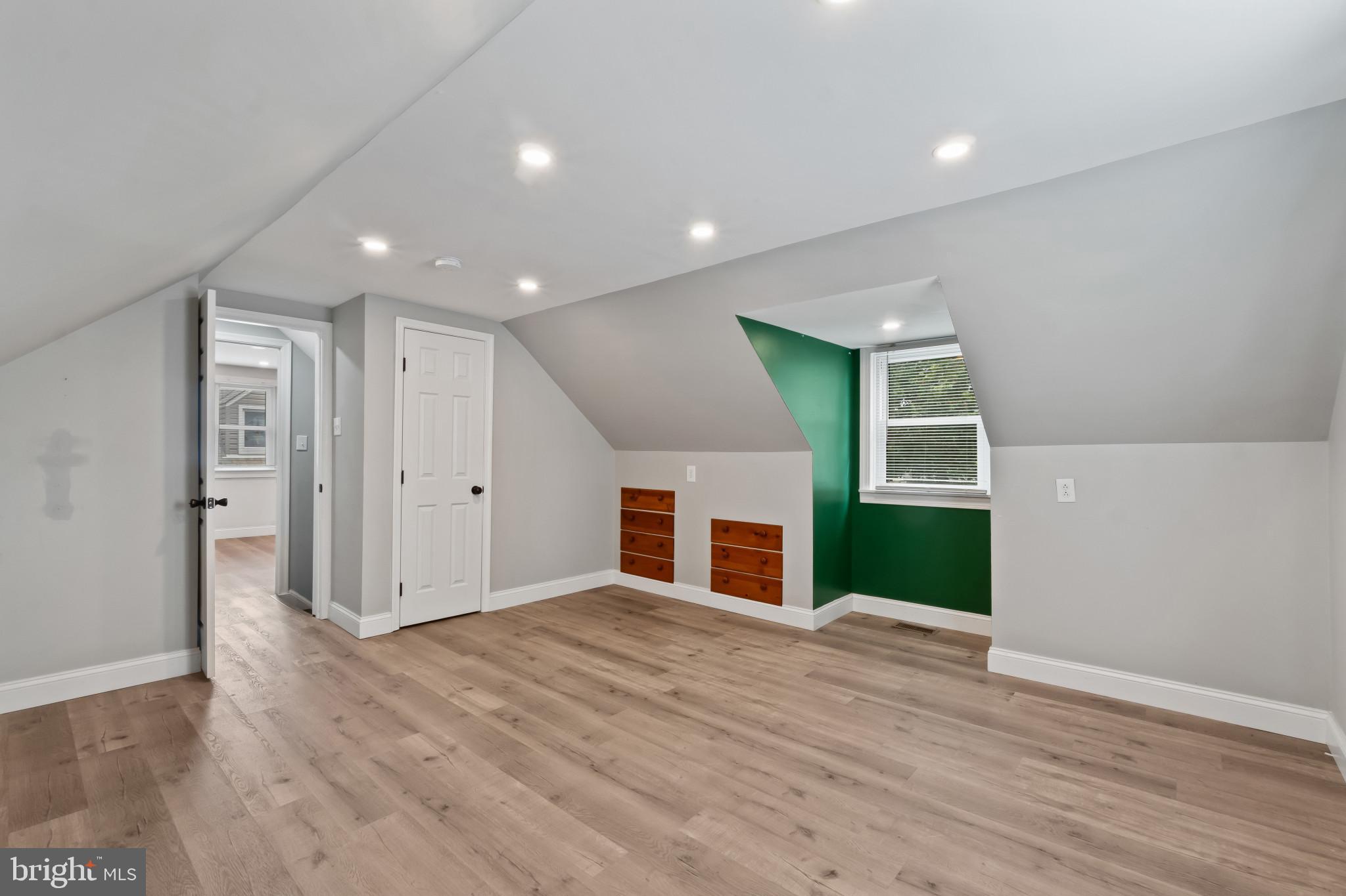 3412 Sollers Point Road Dundalk, MD 21222 - Photo 22 of 31 a view of a livingroom with wooden floor and staircase