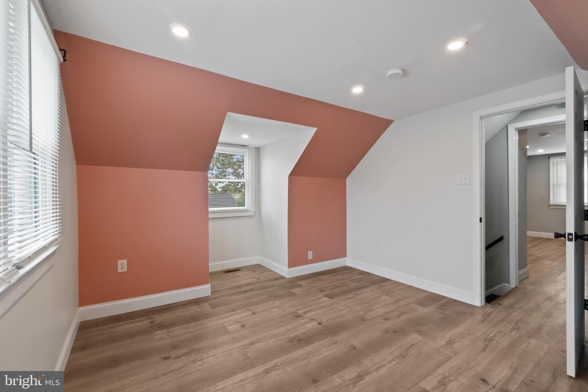 3412 Sollers Point Road Dundalk, MD 21222 - Photo 24 of 31 an empty room with wooden floor and windows