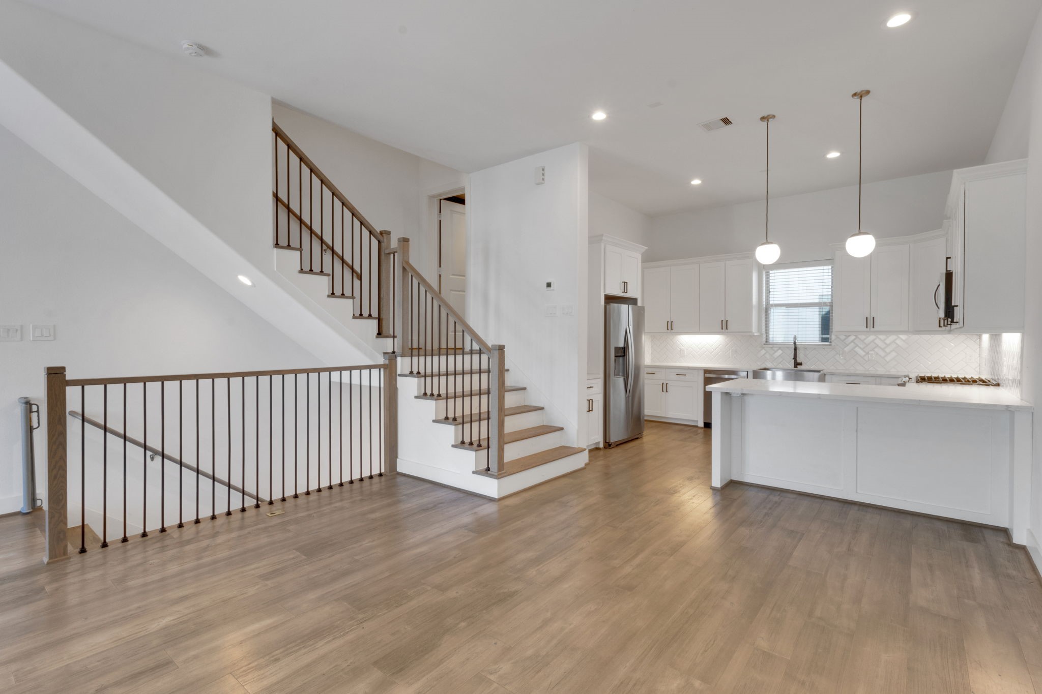 1526 Chestnut Street Houston, TX 77009 - Photo 45 of 45 a large white kitchen with wooden floor and a sink