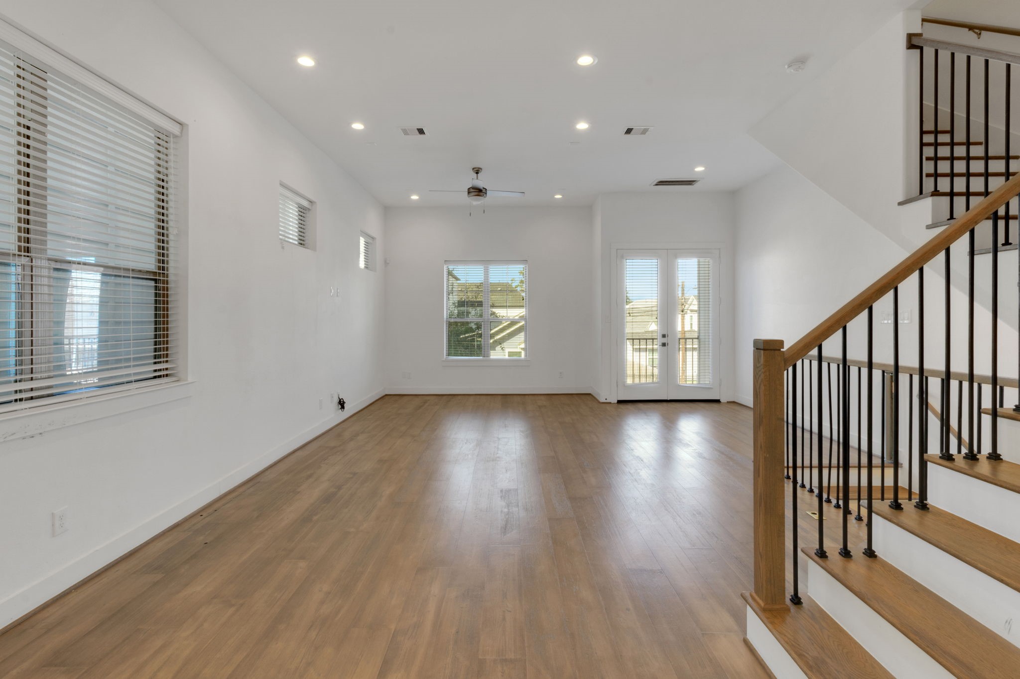 1526 Chestnut Street Houston, TX 77009 - Photo 24 of 45 an empty room with wooden floor and windows