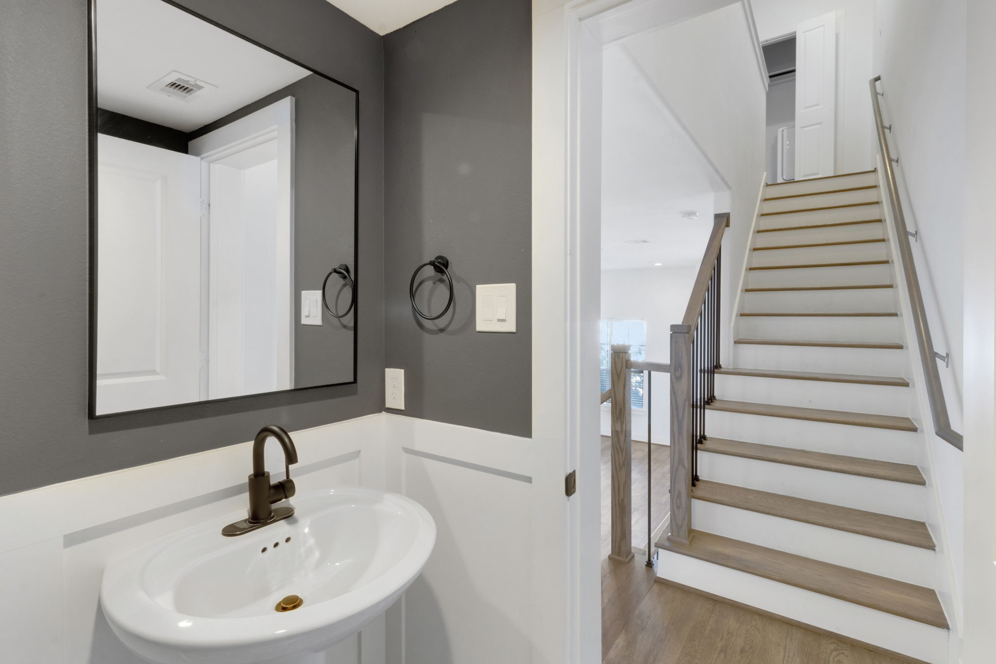 1526 Chestnut Street Houston, TX 77009 - Photo 26 of 45 a bathroom with a sink and a mirror