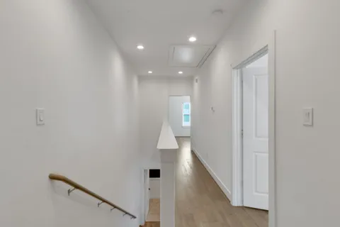 a view of hallway and closet