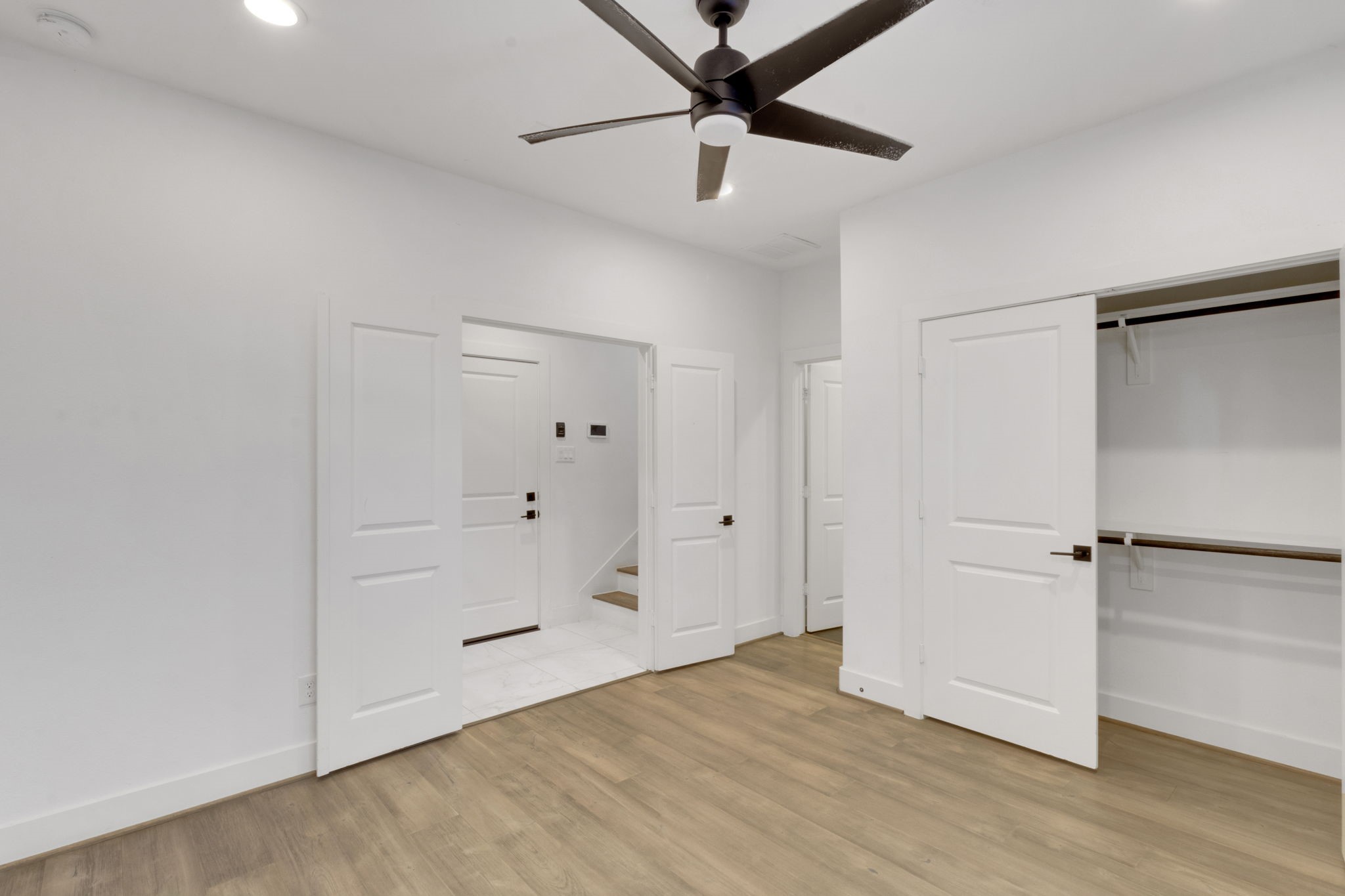 1526 Chestnut Street Houston, TX 77009 - Photo 7 of 45 a view of a room with wooden floor and white walls