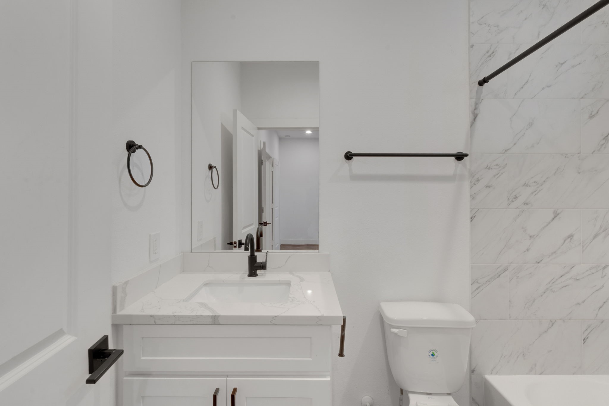 1526 Chestnut Street Houston, TX 77009 - Photo 8 of 45 a bathroom with a sink a toilet and a mirror
