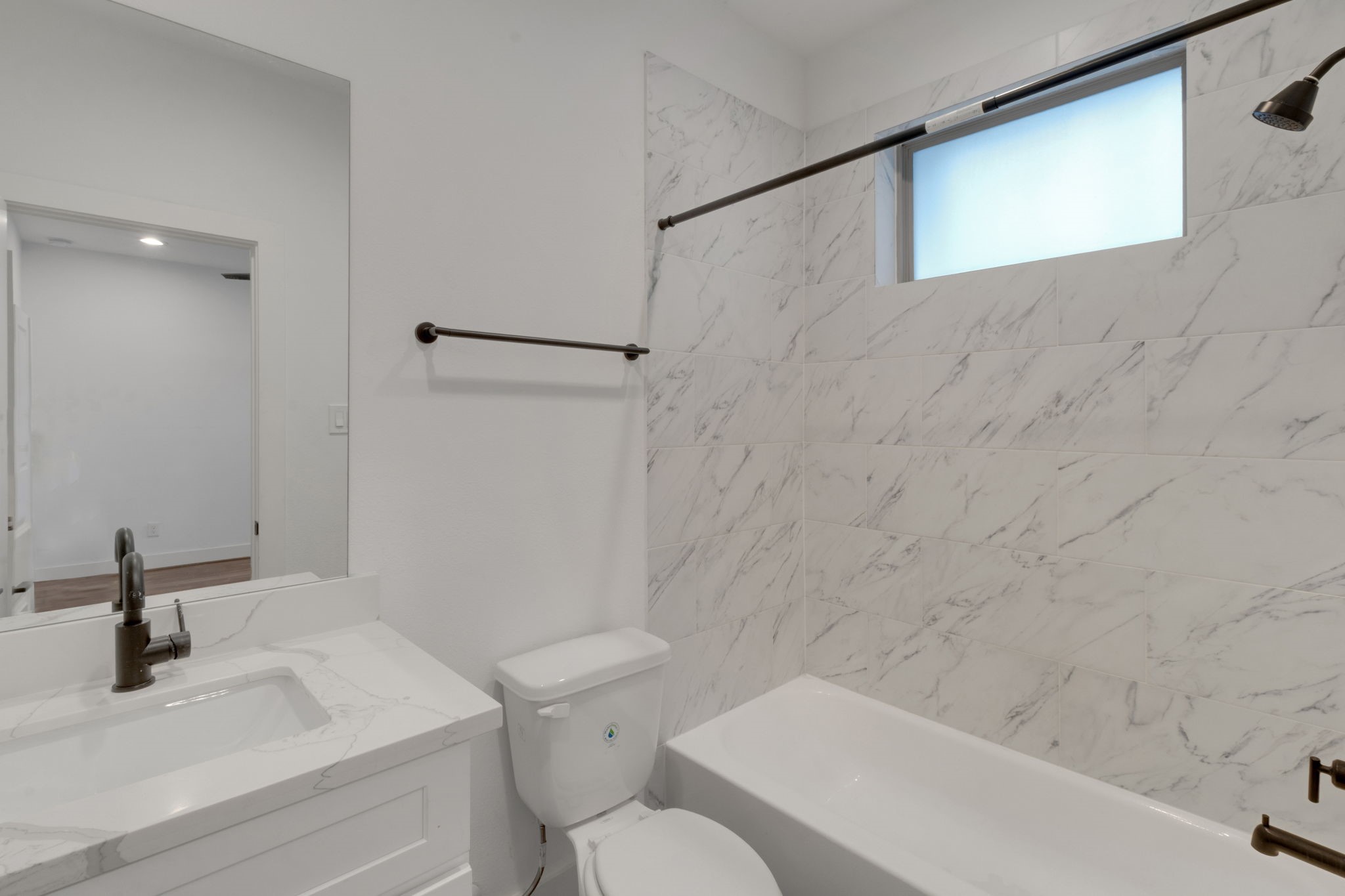1526 Chestnut Street Houston, TX 77009 - Photo 9 of 45 a bathroom with a sink a toilet and a bathtub