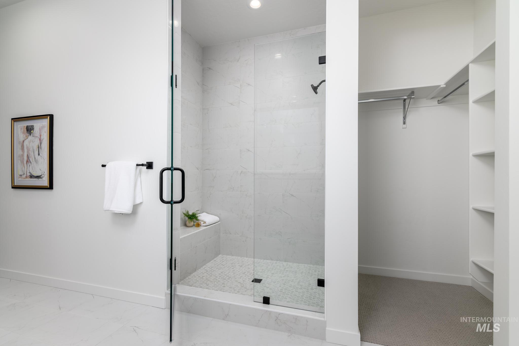 313 Crafts Street Caldwell, ID 83607 - Photo 8 of 9 Bathroom with a spacious closet, a marble finish shower, and recessed lighting