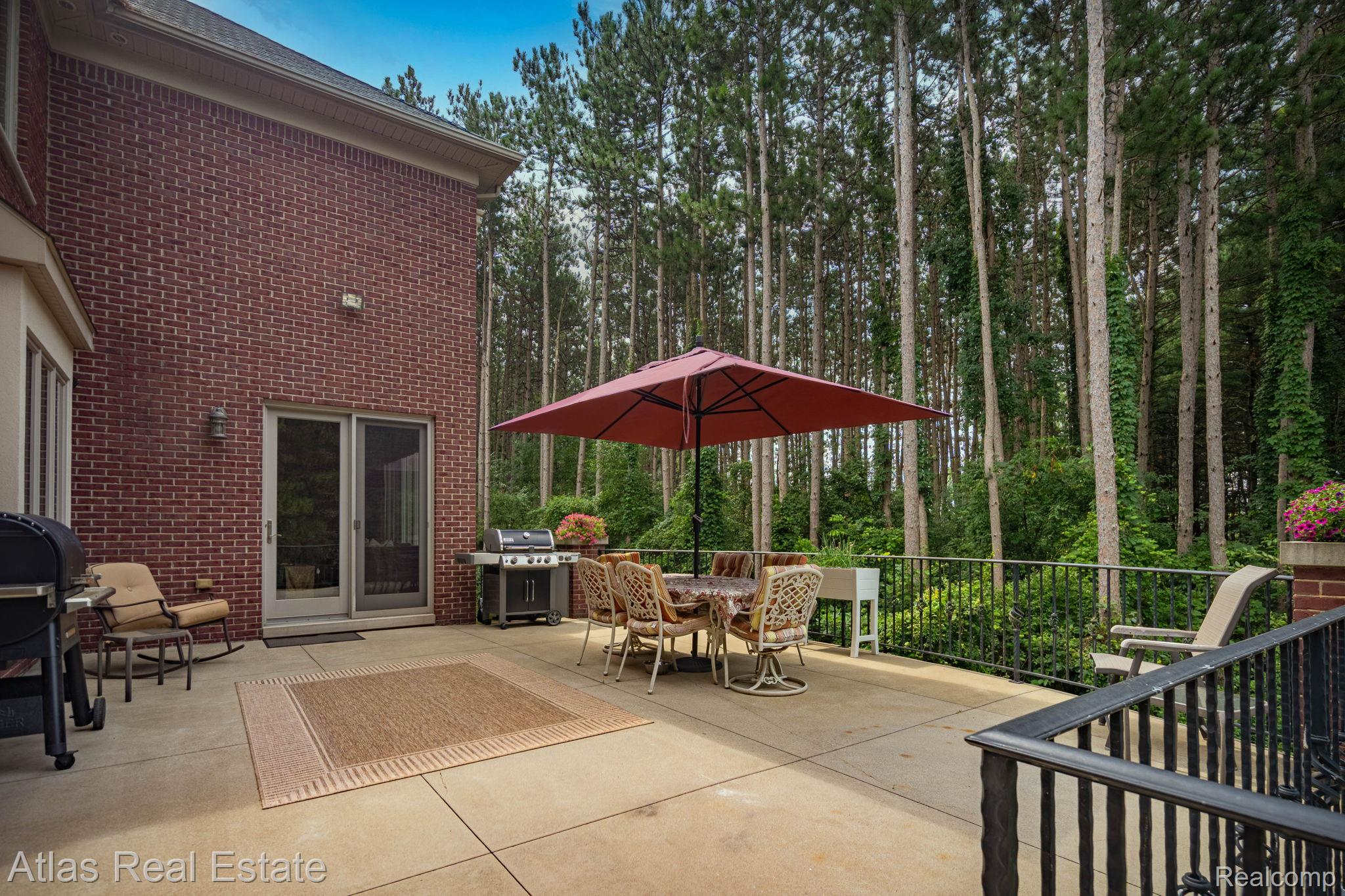 10380 South State Road Goodrich, MI 48438 - Photo 11 of 87 Expansive outdoor patio featuring a concrete surface and direct access to the interior via sliding glass doors