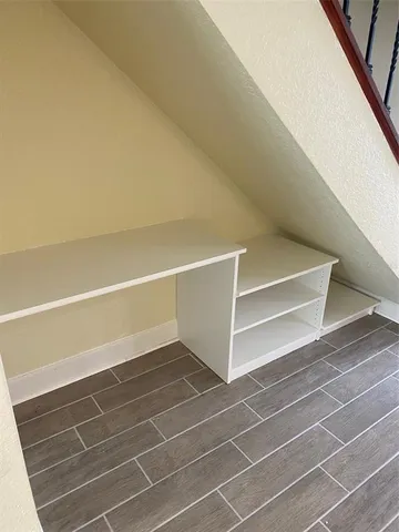 a view of a patio with couches and potted plants