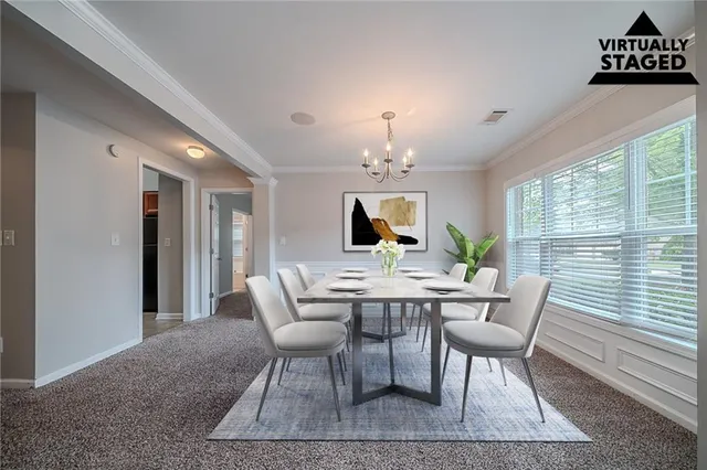 a view of a dining room with furniture window and outside view