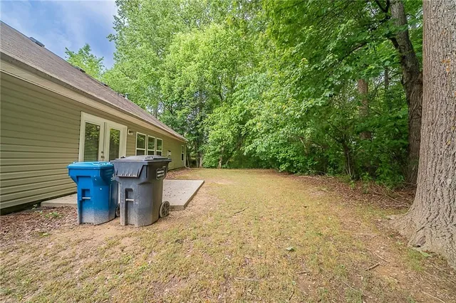a view of a patio with table and chairs
