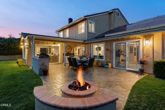 a view of a house with backyard porch and patio