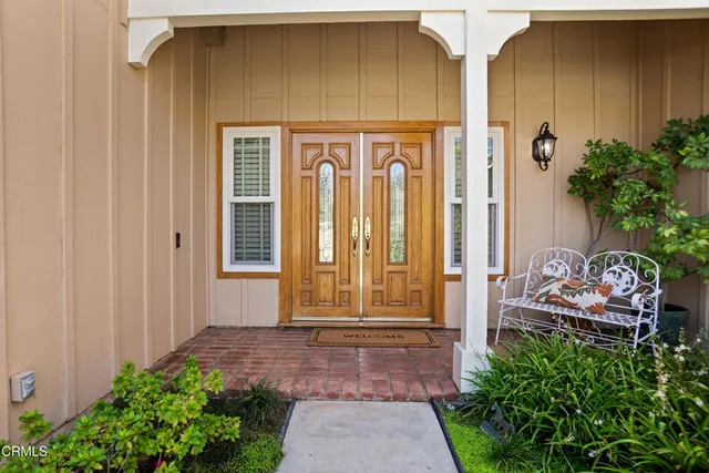 a front view of a house with garden