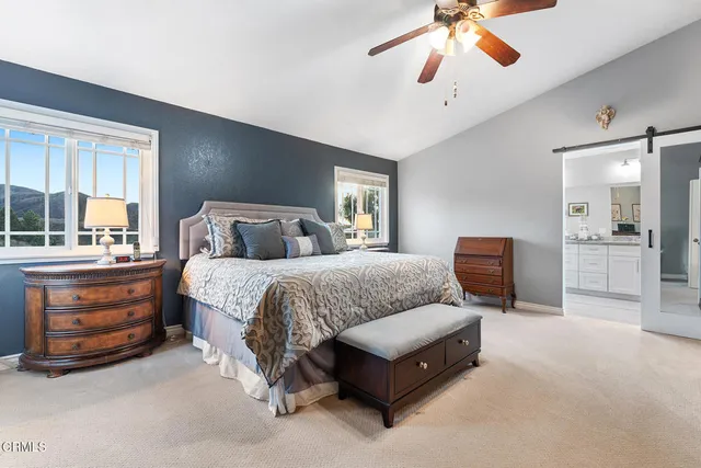 a bedroom with bed and window