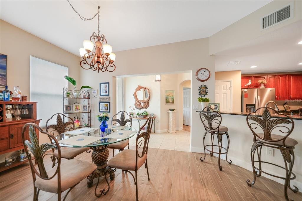 17094 Acapulco Road, Unit 313 Punta Gorda, FL 33955 - Photo 12 of 49 a view of a dining room with furniture window and outside view