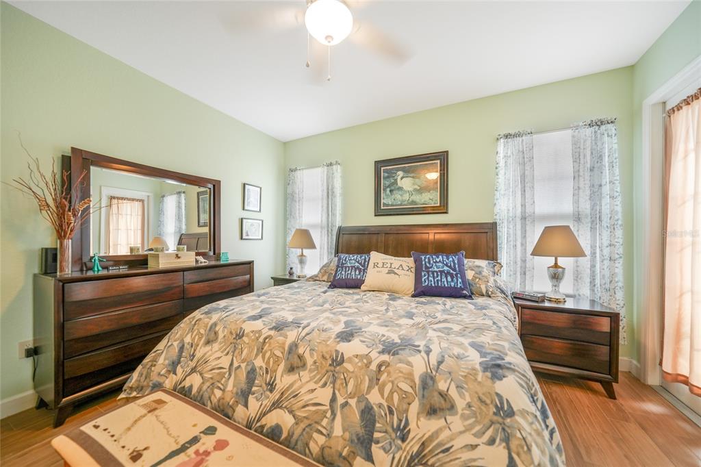 17094 Acapulco Road, Unit 313 Punta Gorda, FL 33955 - Photo 17 of 49 a bedroom with a bed and a chandelier