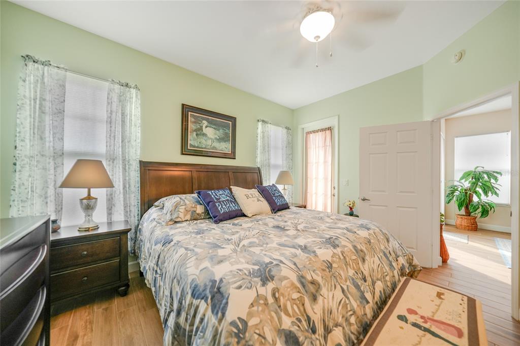 17094 Acapulco Road, Unit 313 Punta Gorda, FL 33955 - Photo 19 of 49 a bed room with a bed and a lamp