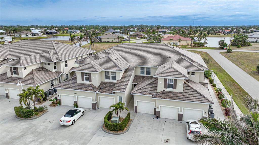 17094 Acapulco Road, Unit 313 Punta Gorda, FL 33955 - Photo 2 of 49 a view of a city with lawn chairs