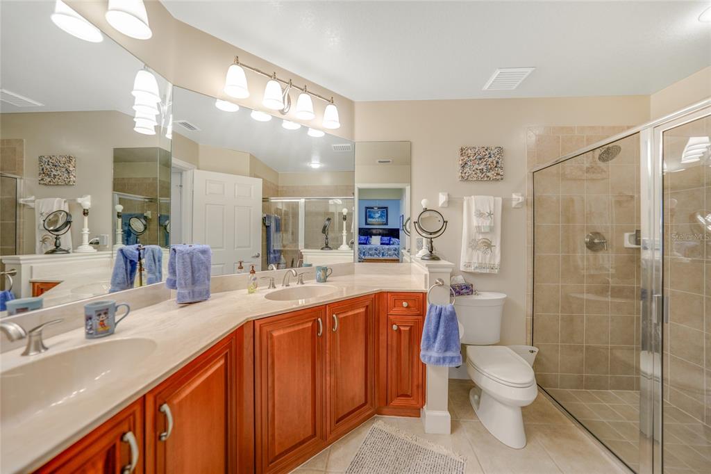 17094 Acapulco Road, Unit 313 Punta Gorda, FL 33955 - Photo 21 of 49 a bathroom with a sink a toilet and shower