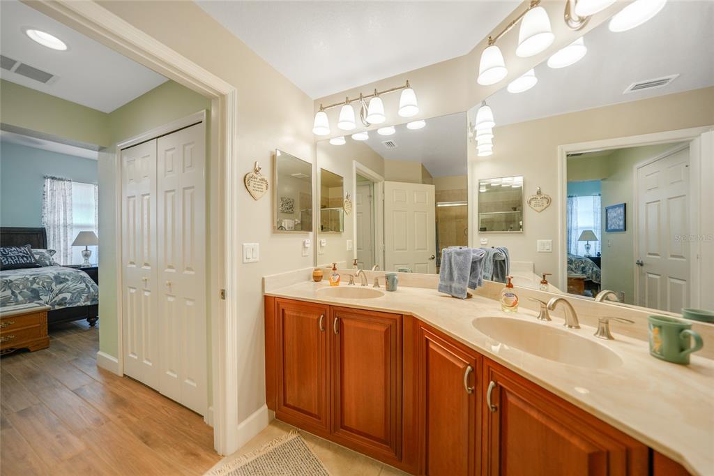 17094 Acapulco Road, Unit 313 Punta Gorda, FL 33955 - Photo 22 of 49 a bathroom with a sink double vanity and a mirror