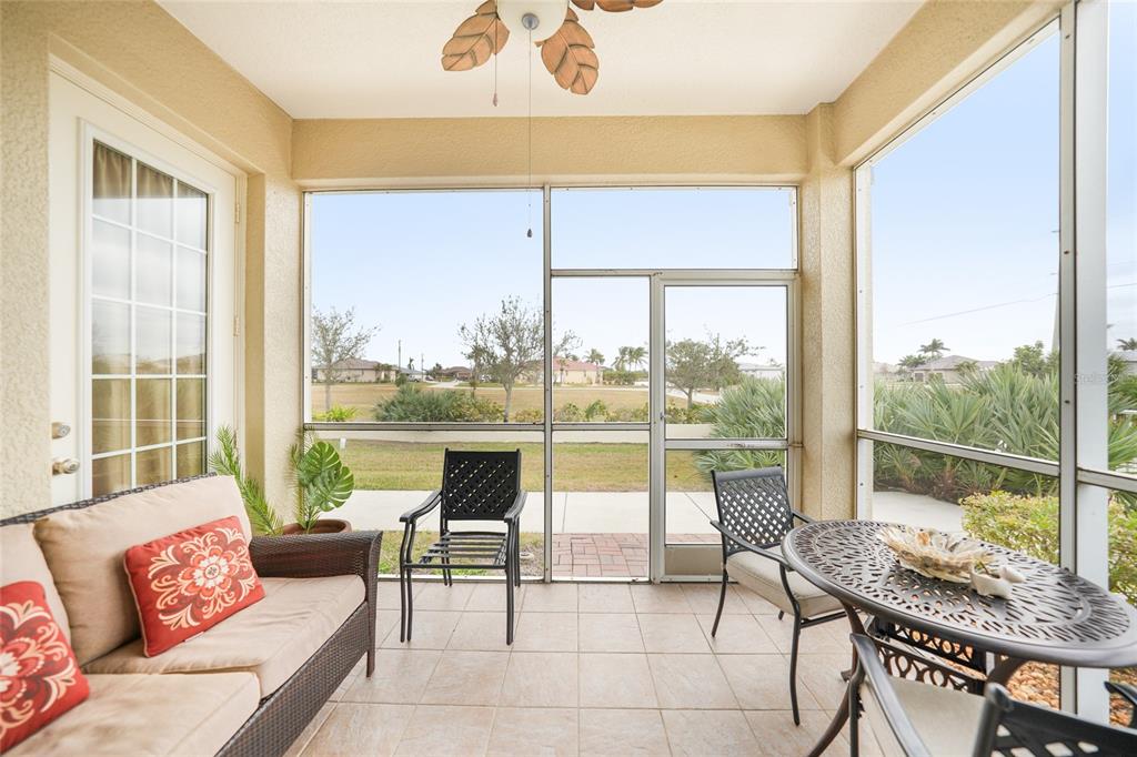 17094 Acapulco Road, Unit 313 Punta Gorda, FL 33955 - Photo 27 of 49 a living room with a large window and a table