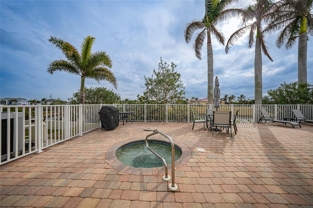 17094 Acapulco Road, Unit 313 Punta Gorda, FL 33955 - Photo 34 of 49 a view of roof deck with palm trees