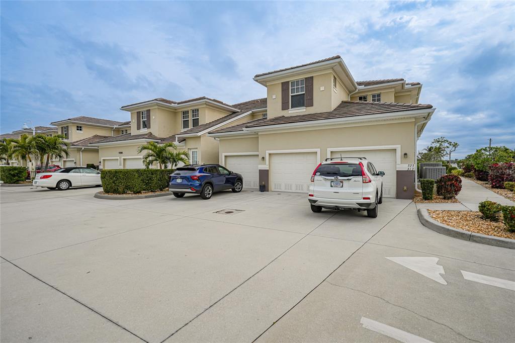 17094 Acapulco Road, Unit 313 Punta Gorda, FL 33955 - Photo 36 of 49 a car parked in front of a house