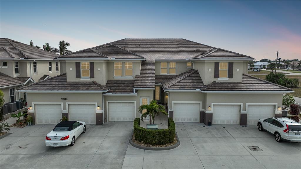 17094 Acapulco Road, Unit 313 Punta Gorda, FL 33955 - Photo 37 of 49 a front view of a house with garden