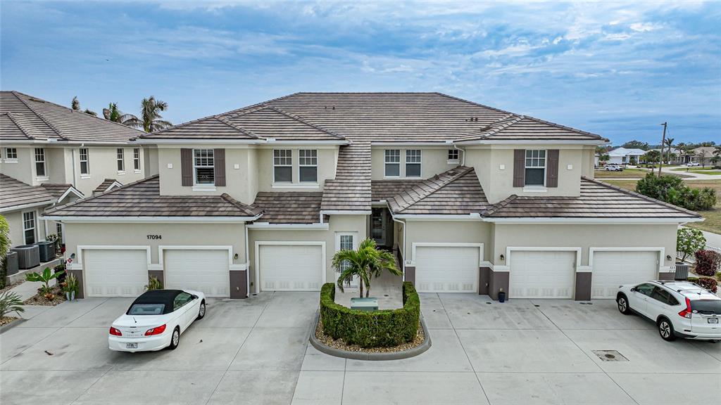 17094 Acapulco Road, Unit 313 Punta Gorda, FL 33955 - Photo 38 of 49 a house view with a outdoor space