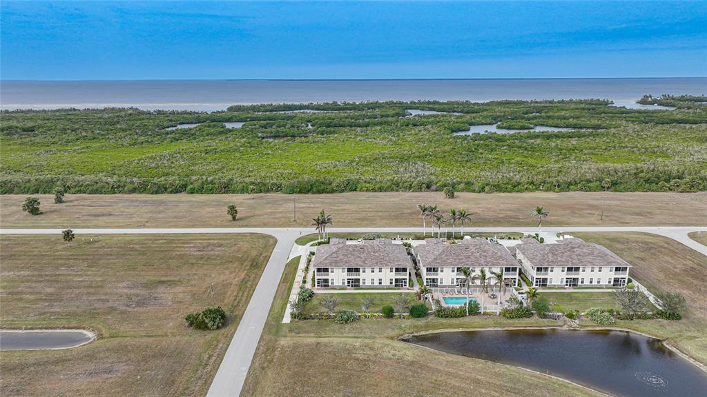 17094 Acapulco Road, Unit 313 Punta Gorda, FL 33955 - Photo 42 of 49 a view of an ocean with a city