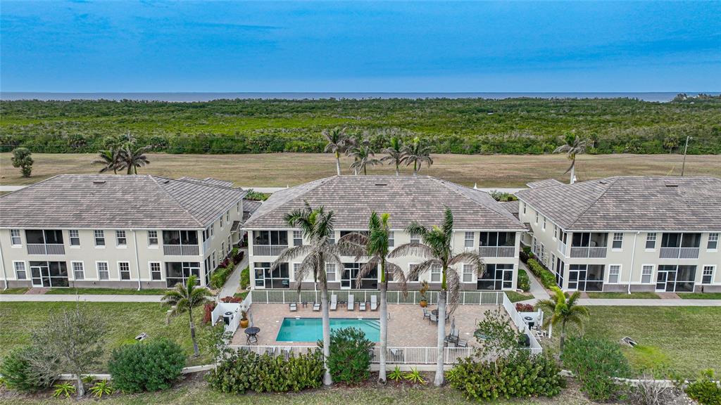 17094 Acapulco Road, Unit 313 Punta Gorda, FL 33955 - Photo 46 of 49 a view of a big house with a yard