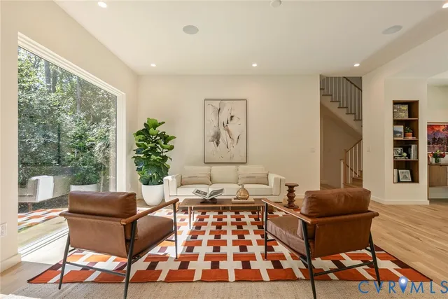 a living room with furniture and a rug